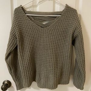 Brand new, never worn cropped olive sweater with lace up back.